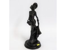 A 20thC. bronze figure of a woman, 13.75in tall