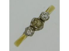 A 18ct gold three stone platinum set diamond ring,