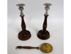 A pair of 1920's oak candle holders twinned with a