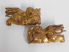 A pair of 19thC. Chinese gilded carved wood roof f