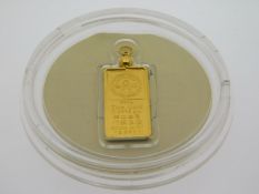 A 24ct gold ingot, 7.48g, 30mm high