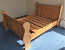 A pine double sleigh bed