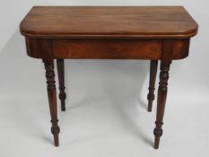 A 19thC. mahogany tea table, 39in wide open x 38.2