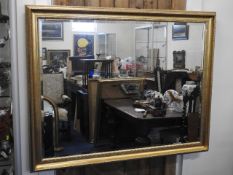 A decorative gilt framed Morris mirror, 51in wide