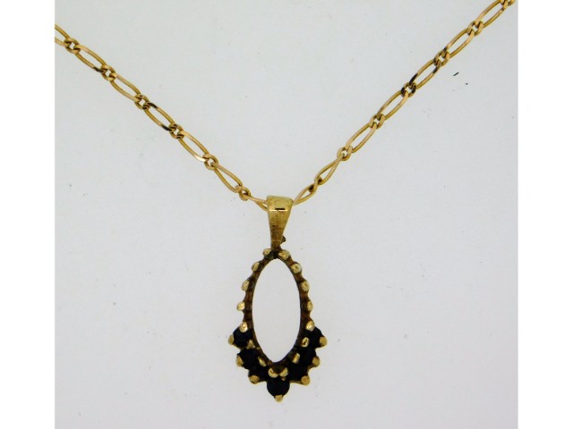A 9ct gold pendant set with sapphire & 19in long,