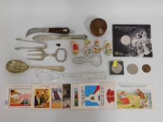 A stone age arrowhead, a QEII £5 crown, postcards