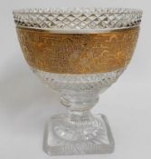 A footed cut glass lead crystal bowl with gilded d