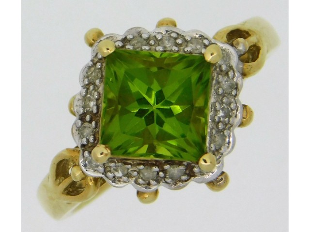 A 9ct gold ring set with peridot & small diamonds,
