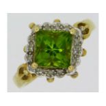 A 9ct gold ring set with peridot & small diamonds,