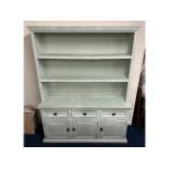 A large painted dresser with three drawers & three