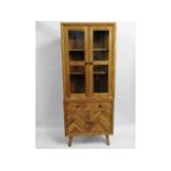 A modern oak corner cabinet with drawers & display