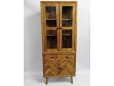 A modern oak corner cabinet with drawers & display