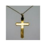 A 9ct gold cross, 39mm high, on an18in long, 9ct g