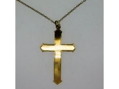 A 9ct gold cross, 39mm high, on an18in long, 9ct g