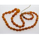 A Victorian amber necklace, 21in long, 29.5g, larg