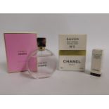 A bottle of Chanel 'Chance' twinned with Chanel no