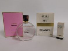 A bottle of Chanel 'Chance' twinned with Chanel no