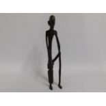 A bronze African figure, seated, 13.75in tall