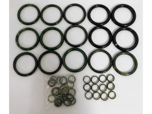 A quantity of Chinese jade bangles & rings