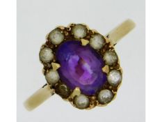 A 9ct gold ring set with amethyst & white stones,