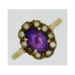 A 9ct gold ring set with amethyst & white stones,