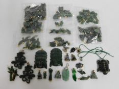 A quantity of Chinese & Oriental jade pendants, most with yellow metal metal fittings