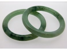 A pair of Chinese jade bangles, internal diameter