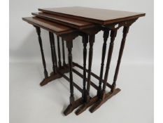 A mahogany nest of three tables, largest 20.5in hi