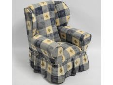 A child's upholstered armchair, 27in high to back