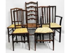 A pair of Edwardian bedroom chairs twinned with th