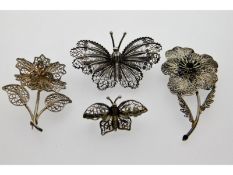 Four silver filigree work brooches, three marked,