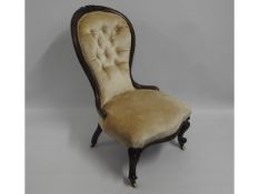 A Victorian walnut button back nursing chair, 36.5