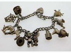 A silver charm bracelet, some charms unmarked, 63.