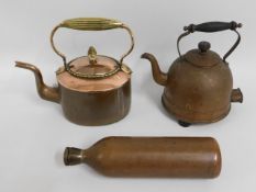 A Georgian copper kettle twinned with two later co
