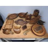 A collection of mixed carved wooden craft items