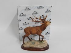 A boxed Border Fine Arts stag, 7in tall