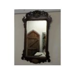 An antique Regency style mirror with bevelled glas