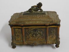 A 19thC. gilt bronze casket with relief decor & ch