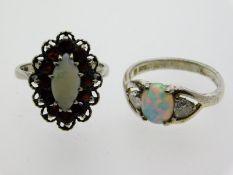 Two silver rings, one with opal & garnet, the othe