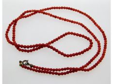 An antique coral beaded necklace, 17.6g, 32in long