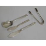 A silver sugar spoon, a silver pair of tongs & two