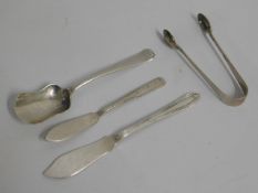 A silver sugar spoon, a silver pair of tongs & two