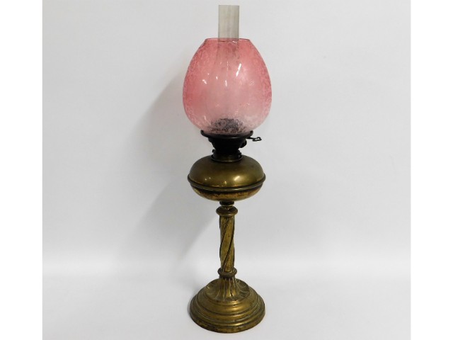 A Victorian brass oil lamp with period etched cran