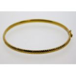 A 9ct gold bangle, diameter 60mm, 4.9g