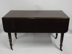 A 19thC. mahogany drop leaf table, 48in wide x 45.