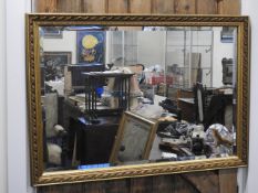 A decorative gilt framed mirror, 38.5in wide x 27.