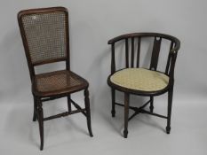 A corner chair twinned with a cane seated chair