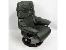 A green Ekornes Stressless reclining armchair with