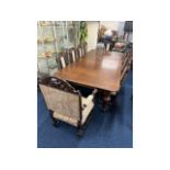 A large Victorian extending oak dining table with