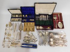 A quantity of mostly plated cutlery, some boxed